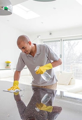 Man Cleaning Table